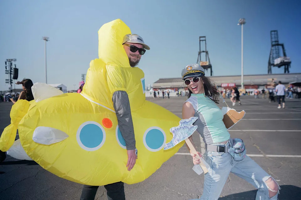 Kyle, left, and Boots from Seattle show off their aquatic outfit theme (in support of their friend Amanda who is about the swim the English Channel) at the Portola Music Festival on Saturday Sept. 20, 2025. (Charles Russo/SFGATE)