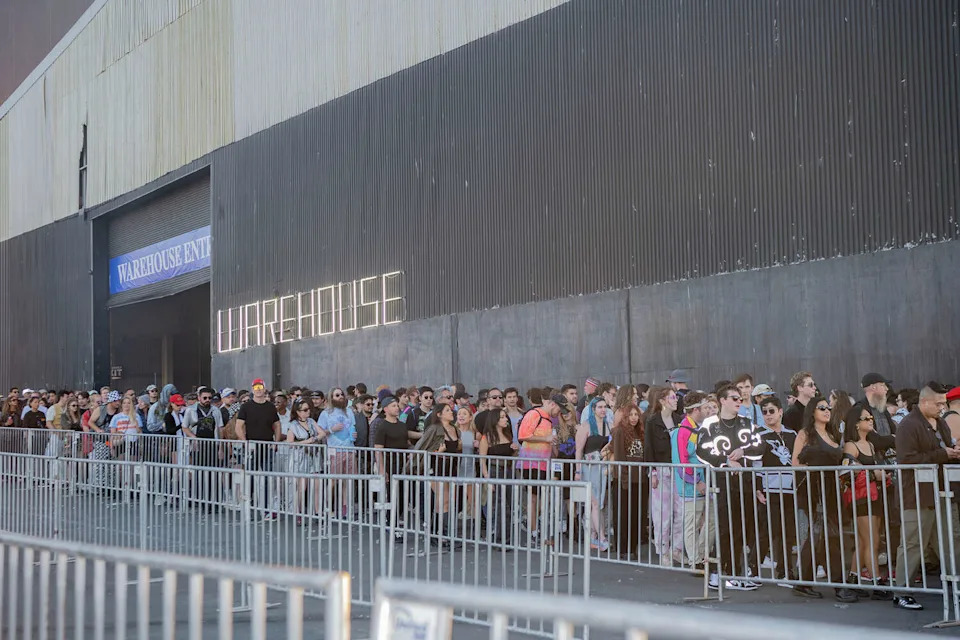 Concertgoers wait on line to get into the Warehouse at the Portola Music Festival on Saturday Sept. 20, 2025. (Charles Russo/SFGATE)