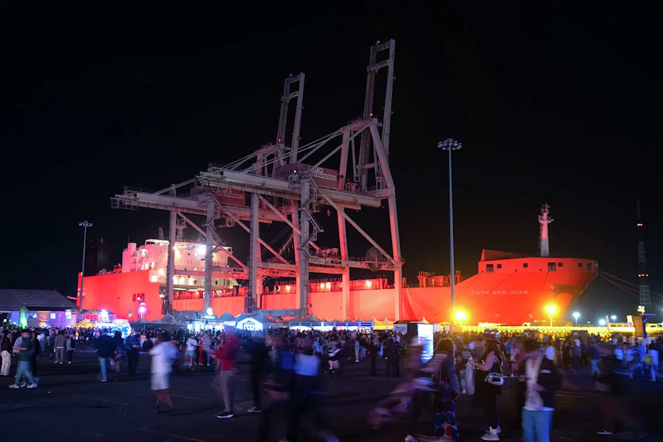 Concert goers walk the festival grounds at Pier 80 at the Portola Music Festival in San Francisco on Saturday Sept. 20, 2025. (Charles Russo/SFGATE)