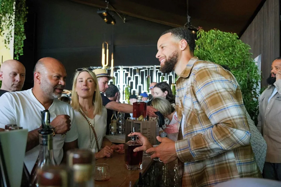 Steph Curry tastes and serves his Gentleman's Cut bourbon at BottleRock Napa Valley on May 25, 2024. He's now opening a bourbon bar in San Francisco. (Camille Cohen/Special to the Chronicle)