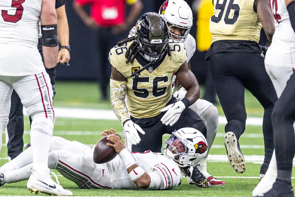 Sep 7, 2025; New Orleans, Louisiana, USA; Arizona Cardinals quarterback Kyler Murray (1) is sacked by New Orleans Saints linebacker Demario Davis (56) during the second half at Caesars Superdome. Mandatory Credit: Stephen Lew-Imagn Images