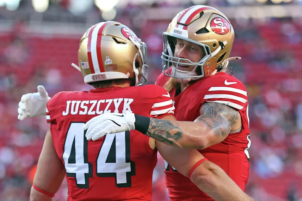 San Francisco 49ers' George Kittle hugs Kyle Juszczyk before Niners play Atlanta Falcons during NFL game at Levi's Stadium in Santa Clara, Calif., on Sunday, October 19, 2025. (Scott Strazzante/S.F. Chronicle)