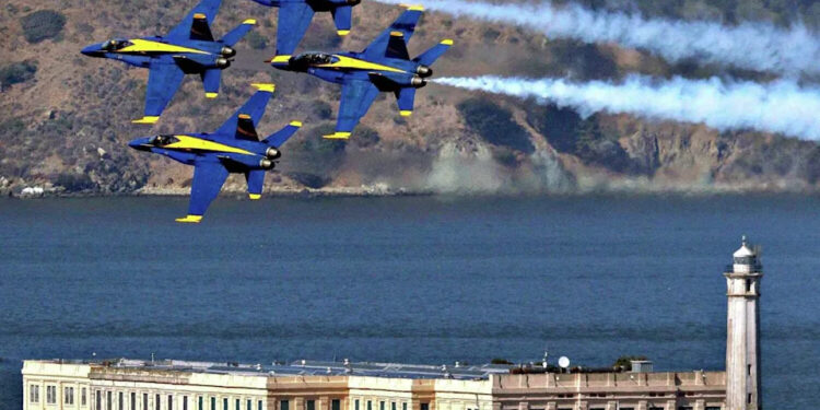 The Blue Angels practice their aerial maneuvers near Alcatraz Island over San Francisco Bay as seen from the Fairmont Hotel in San Francisco on Oct. 10, 2019. (Carlos Avila Gonzalez/S.F. Chronicle)