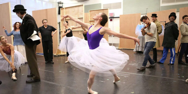 Tiler Peck, center, with cast in rehearsal for the Kennedy Center Production of