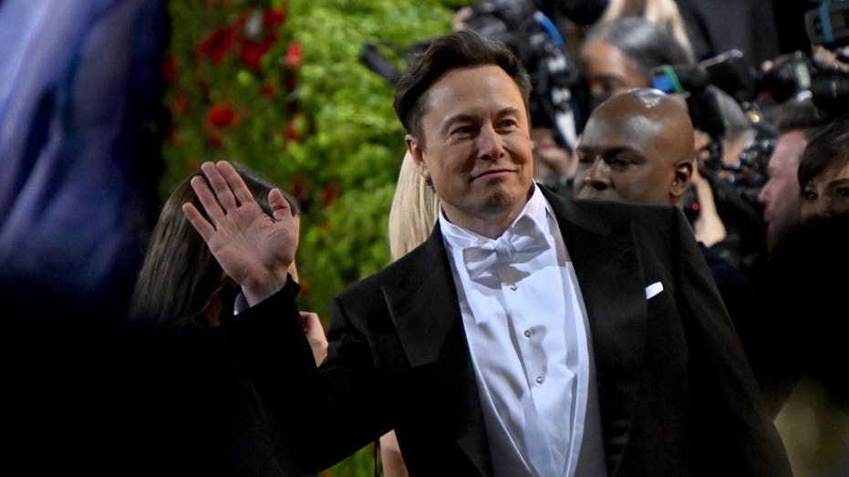 Elon Musk waving