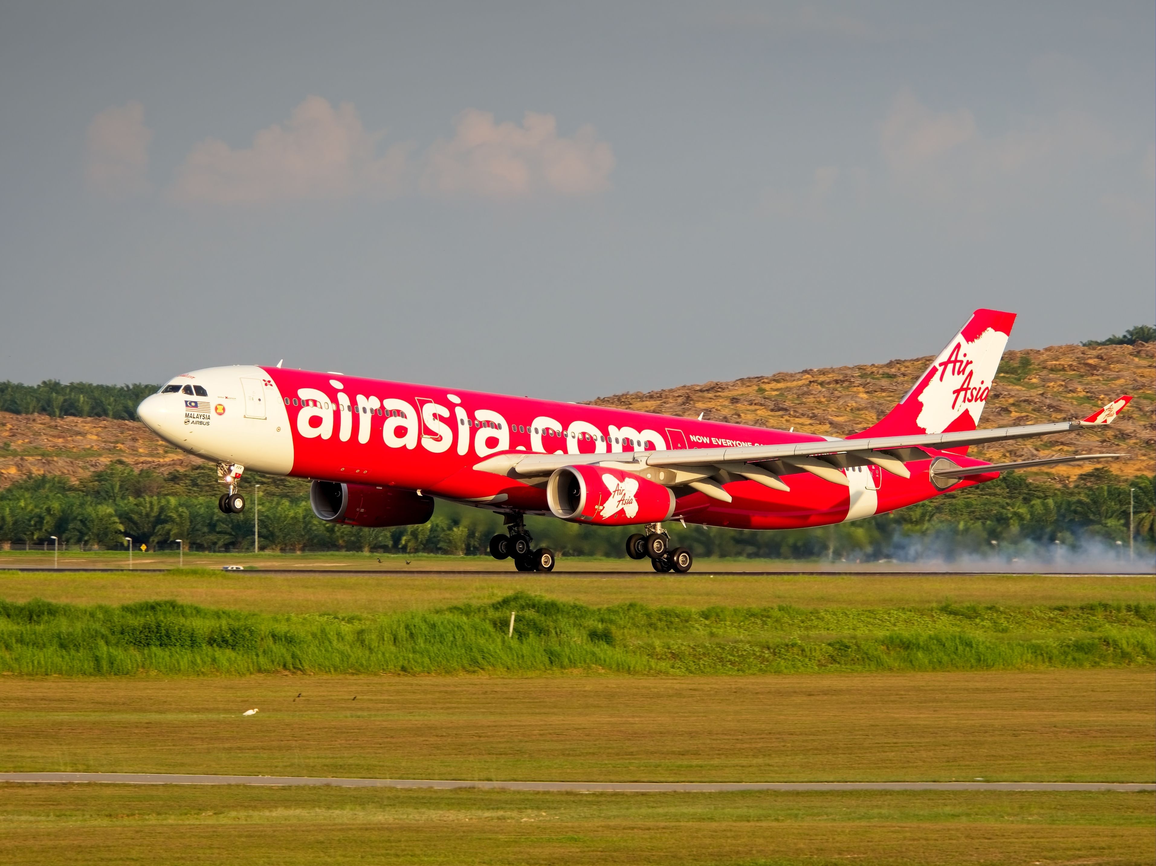 AirAsiaX A330-300 (9M-XXV) touching down at KUL Kuala Lumpur International Airport