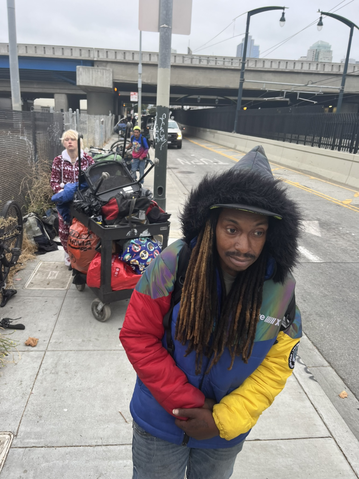 Michael Hood moves on from an illegal homeless encampment that's just been swept by city workers. 'It's way different now. I never heard that if you're homeless, you go to jail,' he says. San Francisco police are now empowered to 'cite and release' people for 'lodging' illegally in public or private spaces.