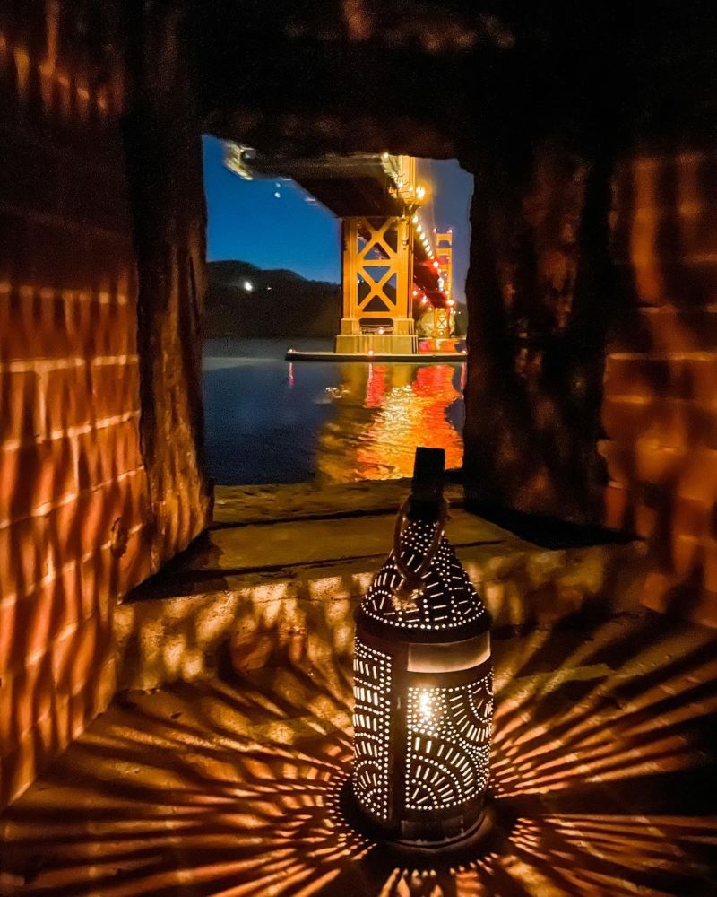 A lantern in a window at Fort Point.