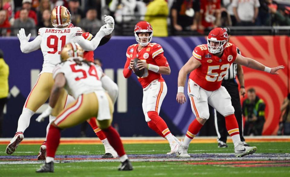 Kansas City Chiefs quarterback Patrick Mahomes (15) looks for an open receiver past the defense of the San Francisco 49ers in the first quarter of Super Bowl LVIII, Sunday, Feb. 11, 2024, in Las Vegas.