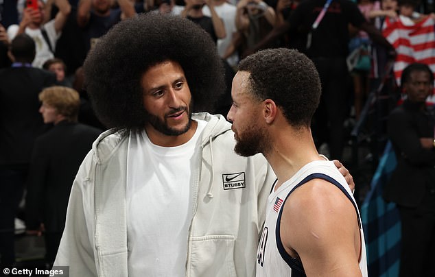 Colin Kaepernick talks with Stephen Curry during the Paris Olympics on August 8